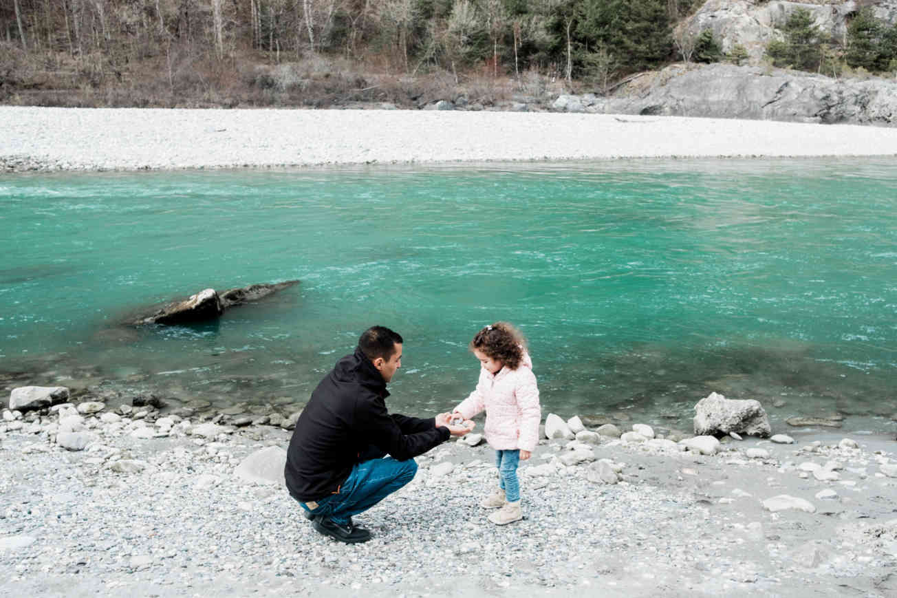 Hamed with his daughter at river
